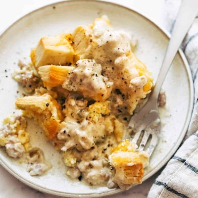Biscuits and gravy egg bake on a plate.