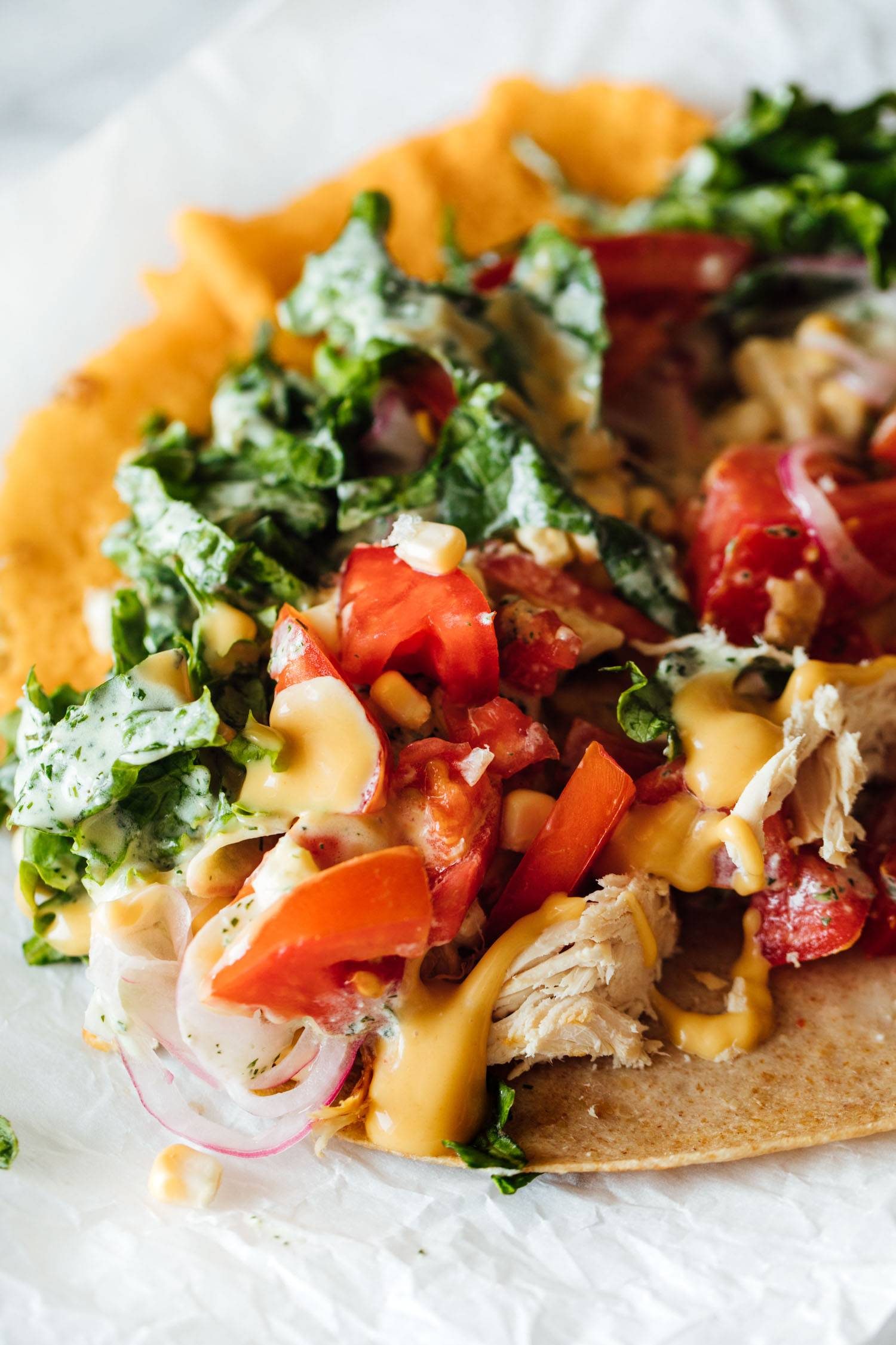 Chicken wraps with tomatoes and kale.