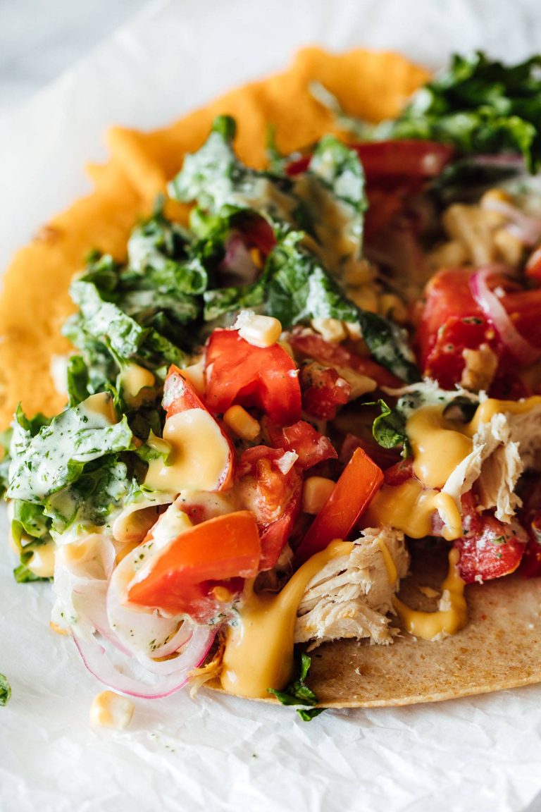 Chicken wraps with tomatoes and kale.