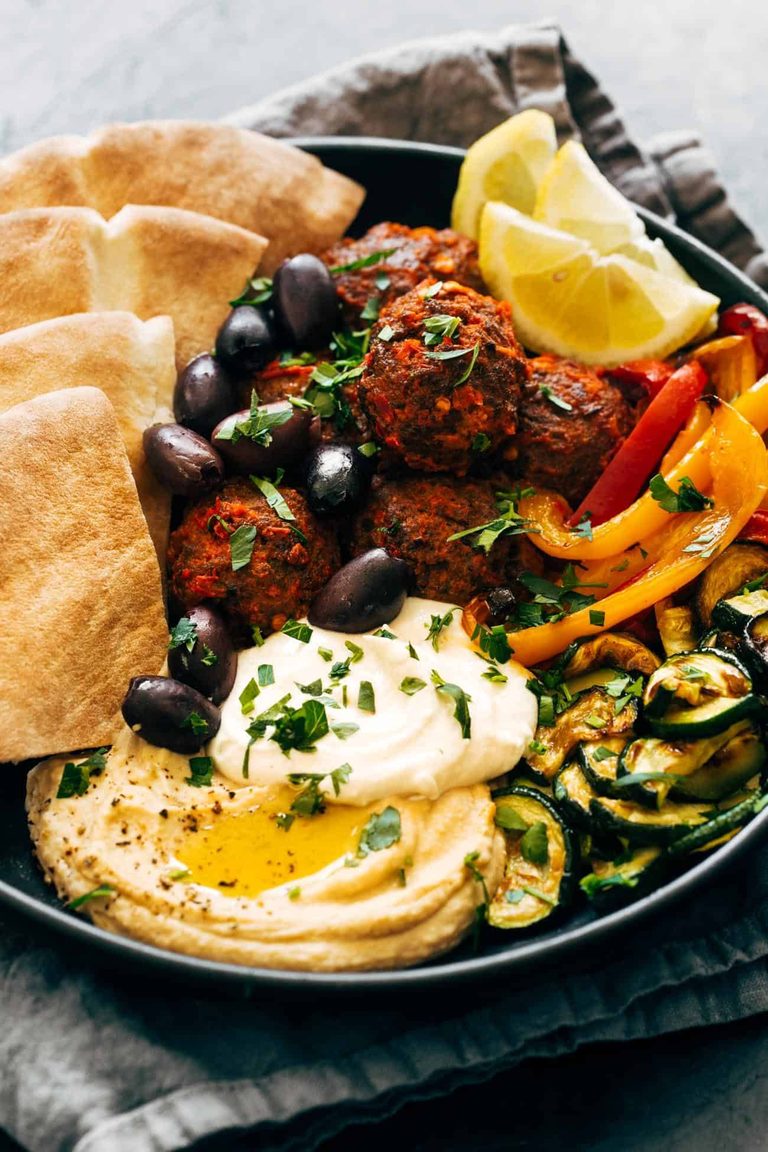Harissa meatballs with hummus, feta, and zucchini.