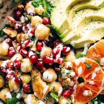 Winter Spa salad in a bowl with chickpeas, avocado, and oranges.