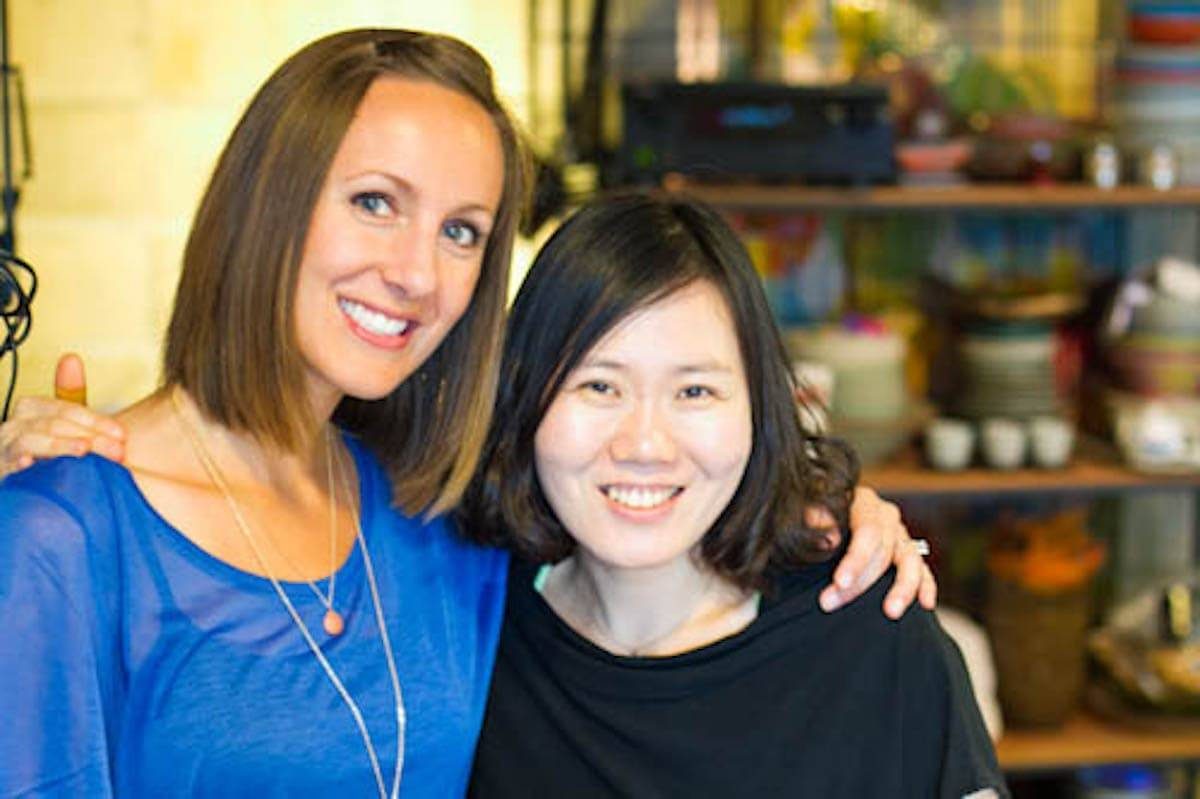 Two women smiling.